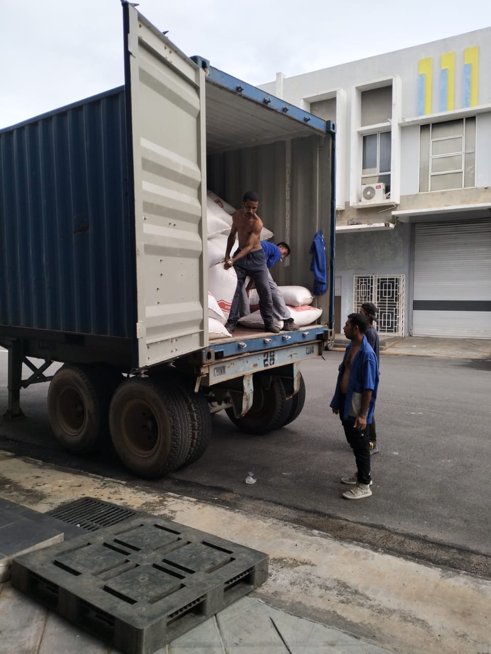 Workers loading a truck at the warehouse