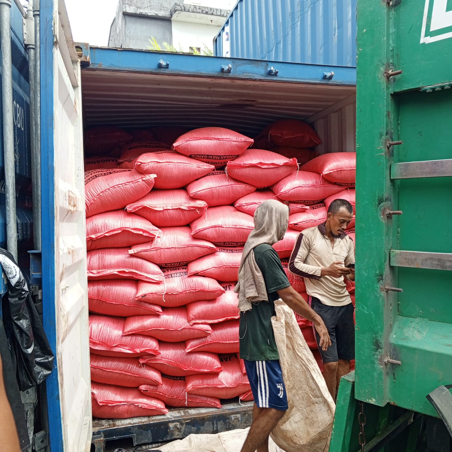 Red sacks stacked inside a shipping container