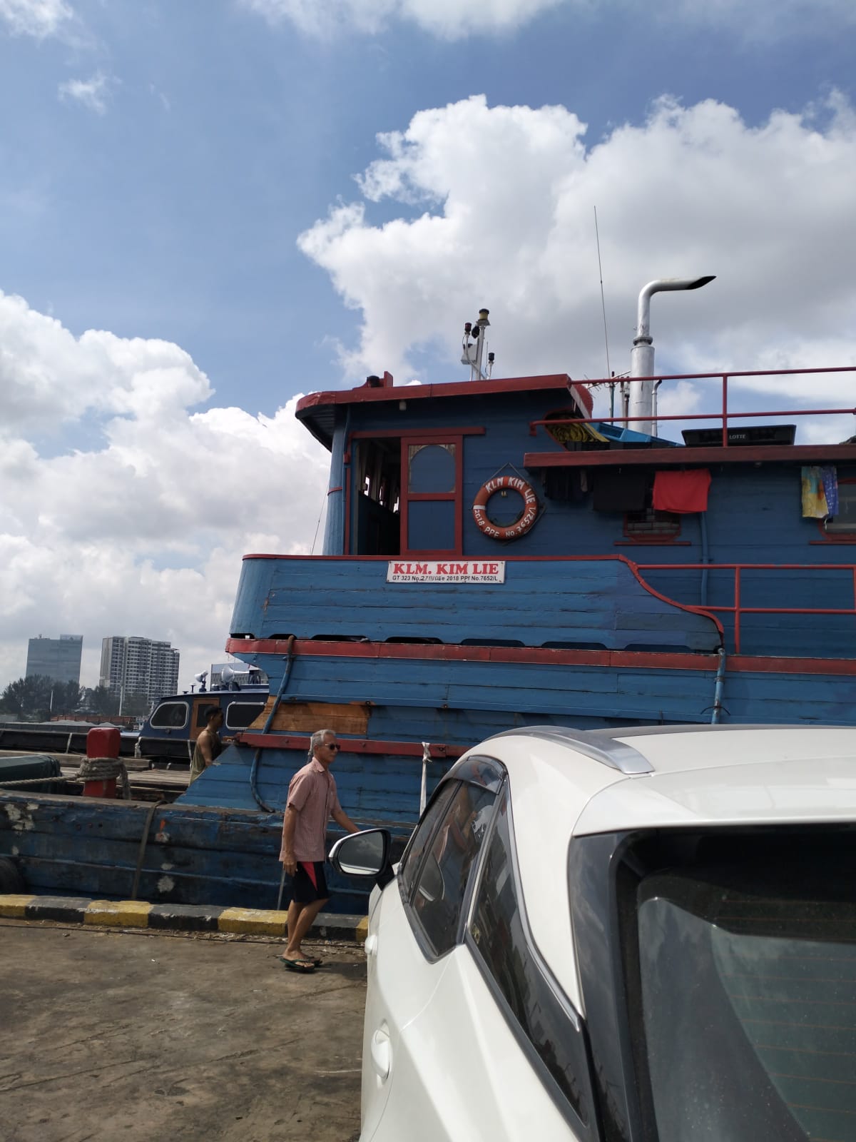 Boat and vehicles at the waterfront